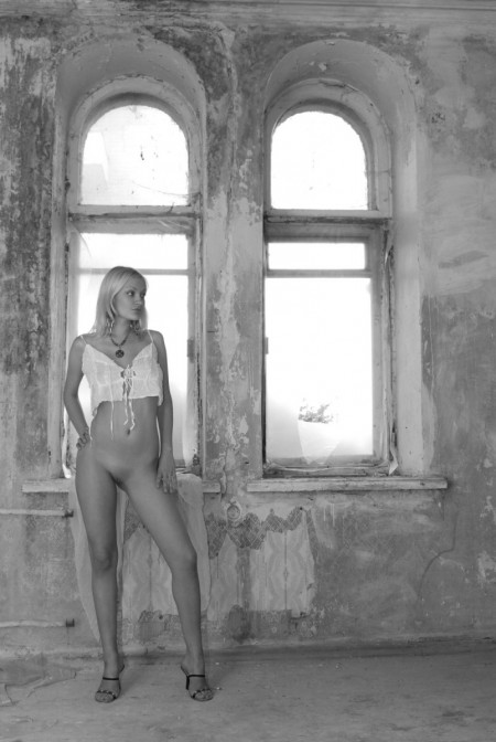 Blonde  in an old house