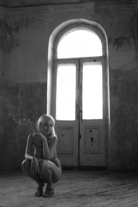 Blonde  in an old house