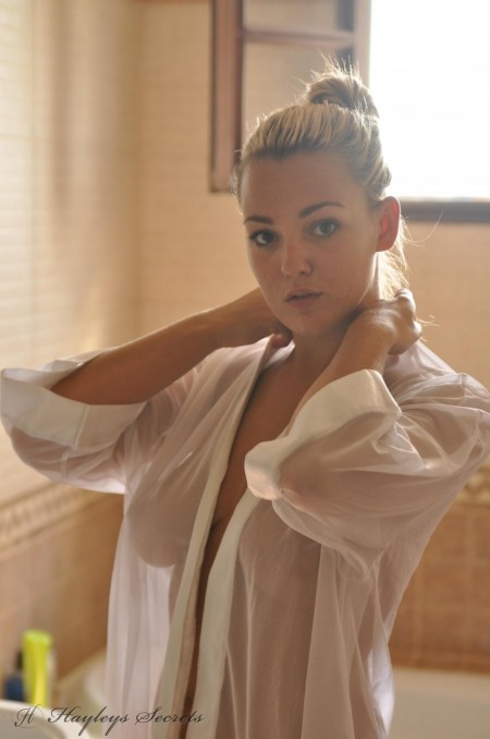 Jodie Gasson Beautiful blonde chick  pulls on a see thru blouse in the morning